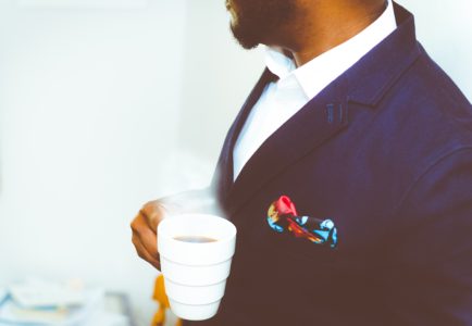 Man with chronic pelvic pain syndrome holding coffee